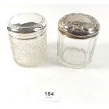 Two cut glass and silver topped toiletry jars