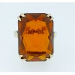 A 9 carat gold dress ring set orange stone, size K, 4.6g