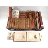 A group of literary books in leather bindings and a Victorian photograph album
