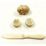 Two Meiji period ivory Japanese pill boxes with engraved lion and elephant head, an antique ivory