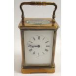 A 19th century brass striking carriage clock with key, 17.5cm tall