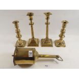 Two pairs of brass candlesticks and a bottle jack