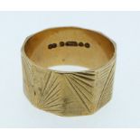 A 9 carat gold ring with engraved decoration, size K, 2.5g