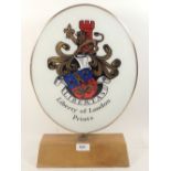 A Liberty Fabrics shop double sided Advertising oval plaque on wooden stand, 43cm tall