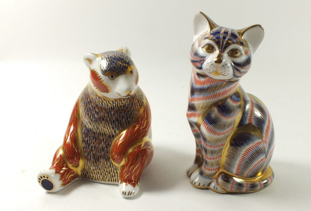 A group of two Royal Crown Derby Imari paperweights in the form of a honey bear and cat (silver