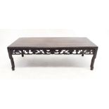 An early 20th century Chinese low opium table with carved frieze, 102 x 41cm
