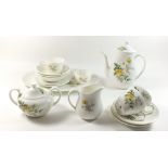 A Wedgwood 'Golden Glory' part tea service comprising: teapot, three cups and saucers, sugar,
