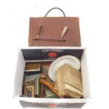 A box of miscellaneous collectables including cigarette cards, enamel ware, pair of wooden shoe