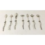 A set of seven Japanese silver teaspoons with bamboo stems and stylised leaf terminals (tested