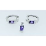 A pair of 9 carat white gold earrings set amethyst and chip diamonds and a matching pendant, 7g