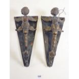 A pair of unusual large bronze carayatid door handles, 30cm tall