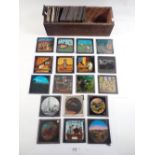 A selection of coloured and hand painted magic lantern slides, mainly showing animals but also