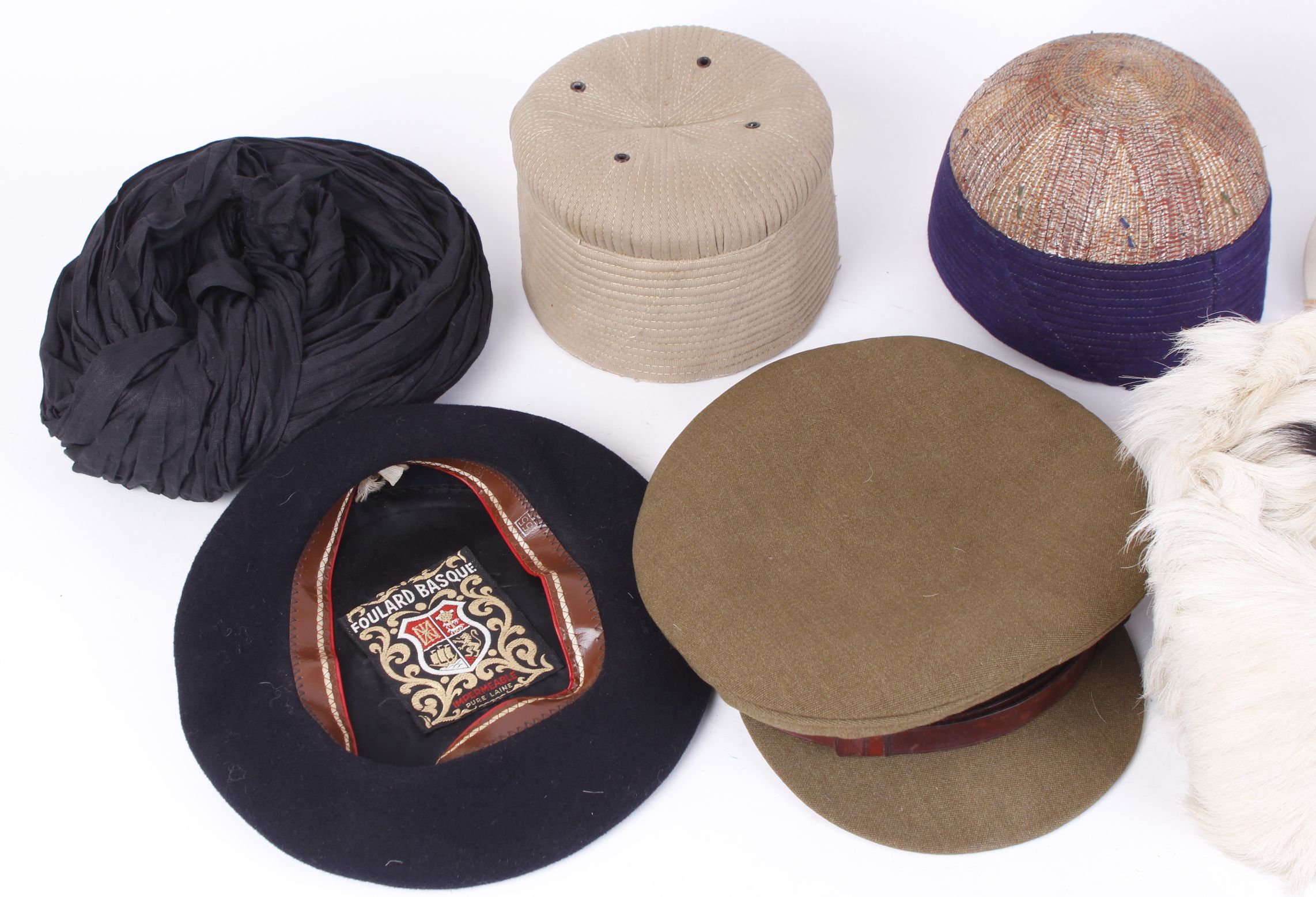 Two embroidered Indian skull caps and one other; Afhgan goat skin cap; British army field cap; - Image 2 of 4