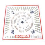 Norma cartridge and bullet display board, in original Norma plastic frame