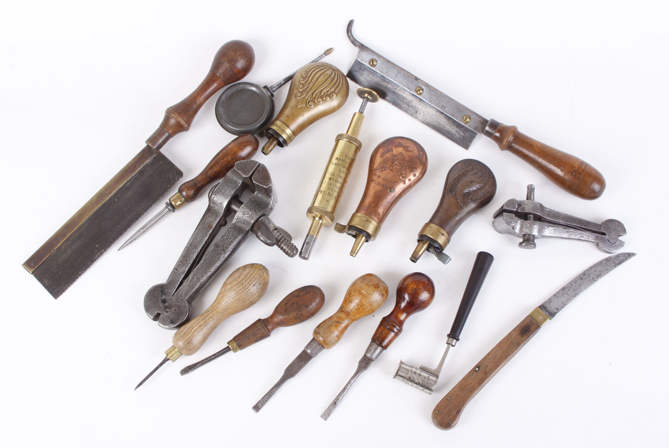 3 small brass and copper powder flasks, wooden handled tools incl. chisels and saws, brass Wakefield