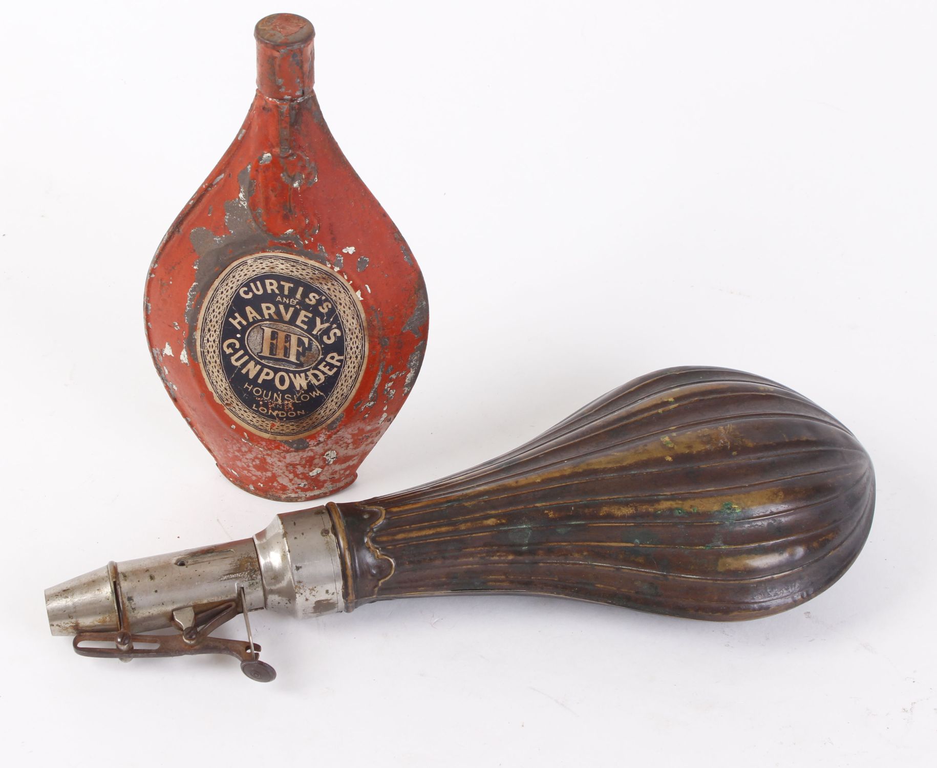 11¼ ins Carwell's Patent powder flask together with Curtis and Harvey powder tin with Manton label