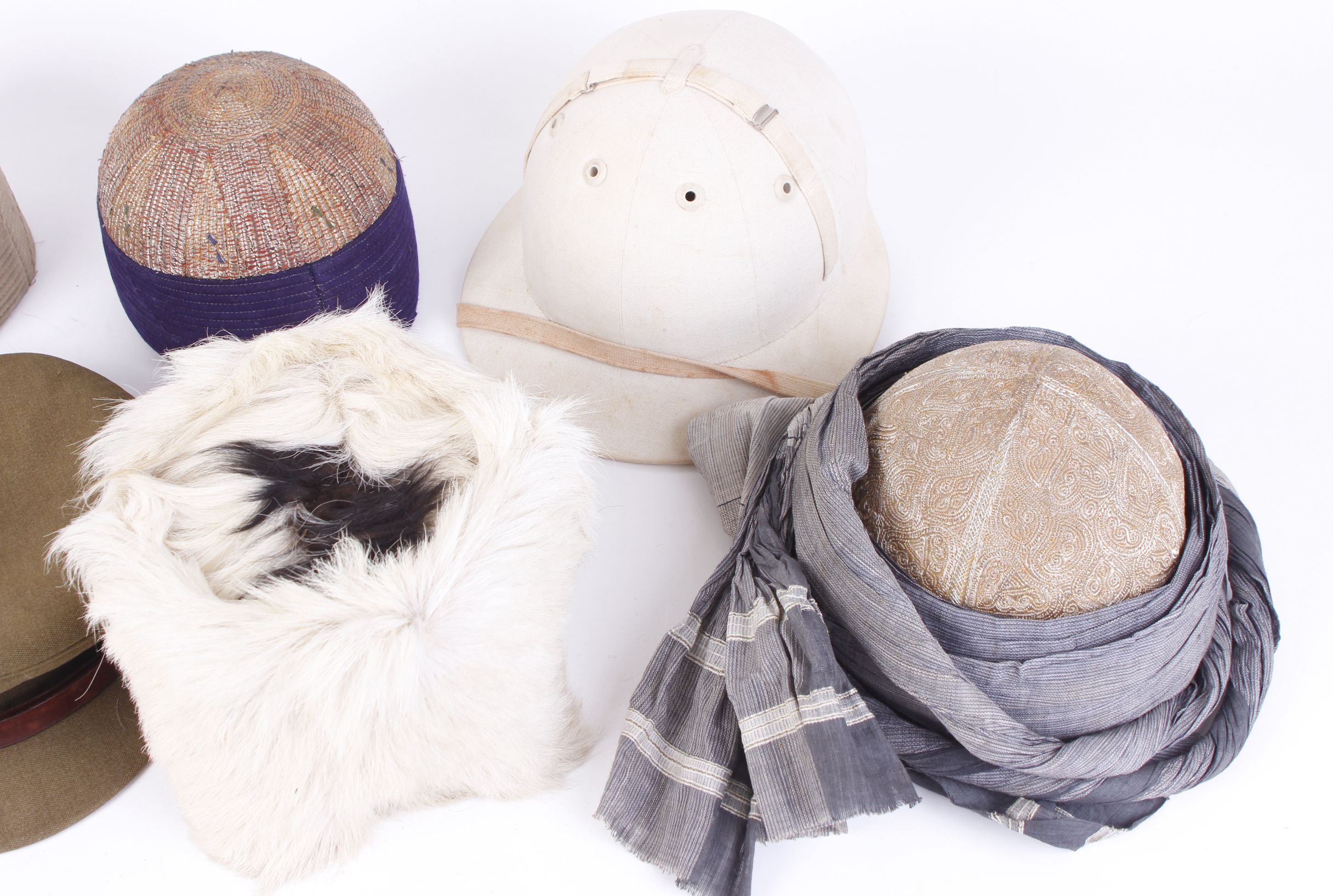 Two embroidered Indian skull caps and one other; Afhgan goat skin cap; British army field cap; - Image 3 of 4