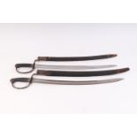 Two Victorian Police cutlasses, each with 24 ins curved single edged fullered blade (one etched