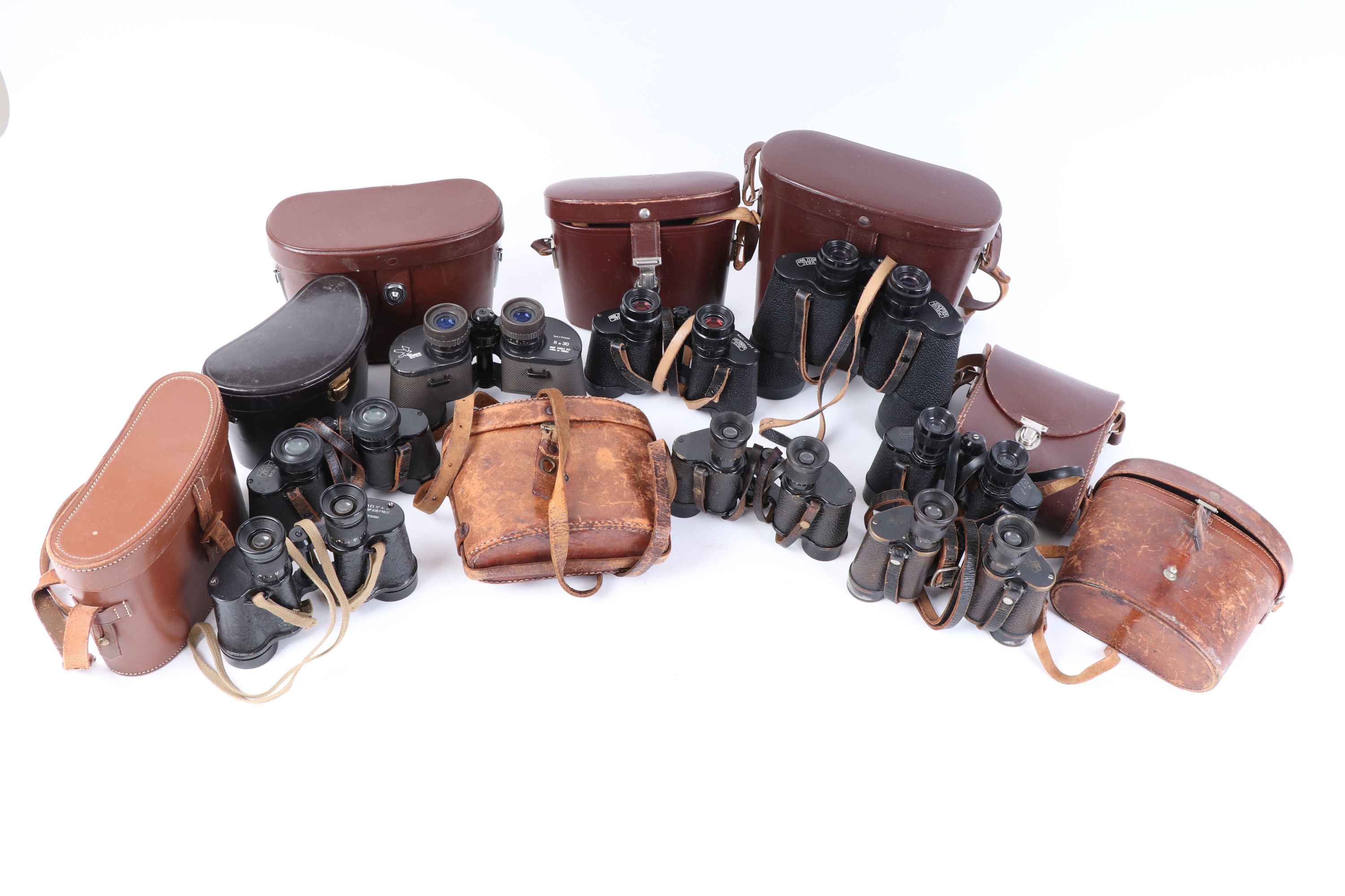 Eight various cased pairs of binoculars