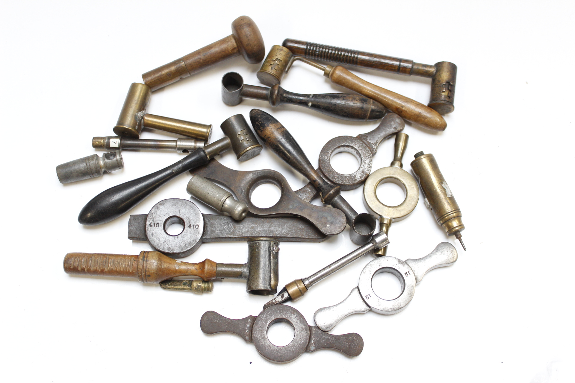 A collection of vintage case reloading tools and English and foreign powder measures