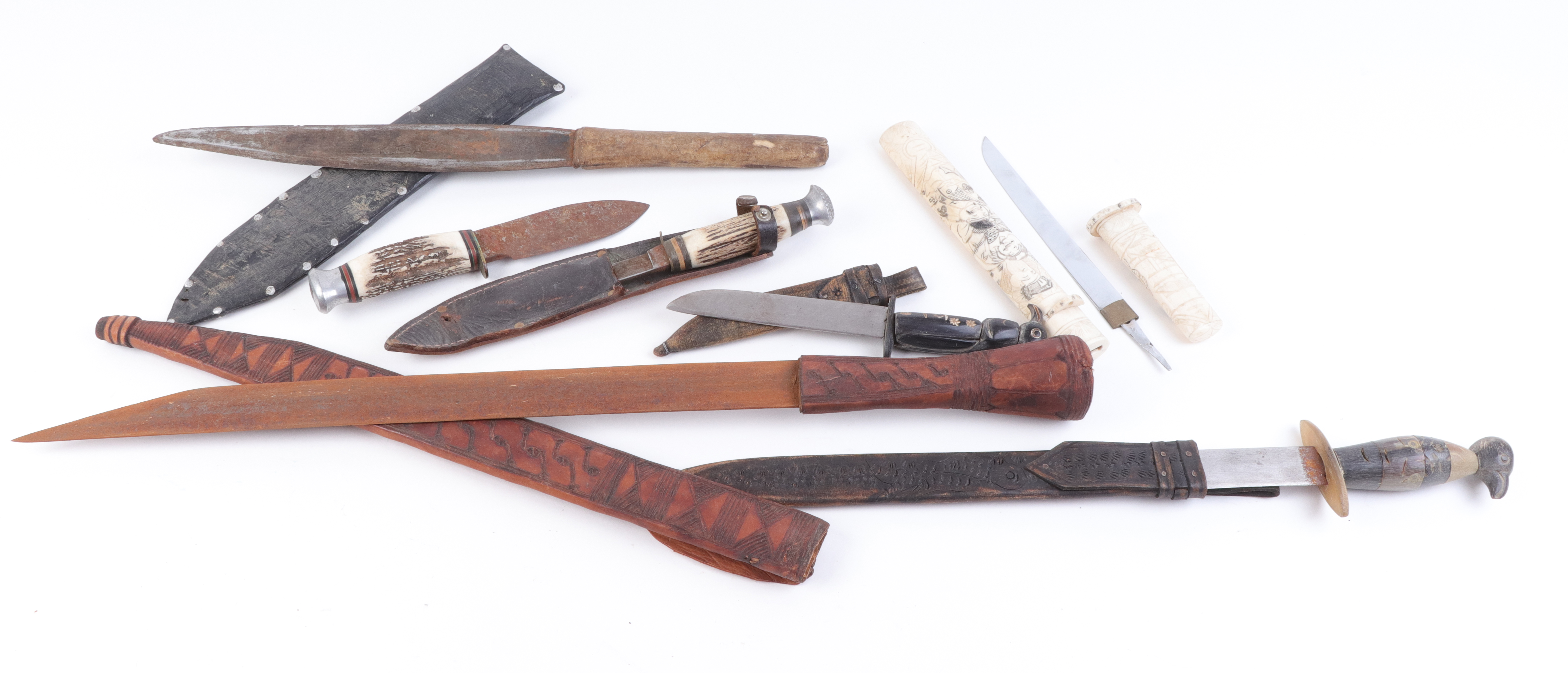 Seven various knives incl.: 4½ ins blade with ebony carved bird handle, in leather sheath, and 10¾ i