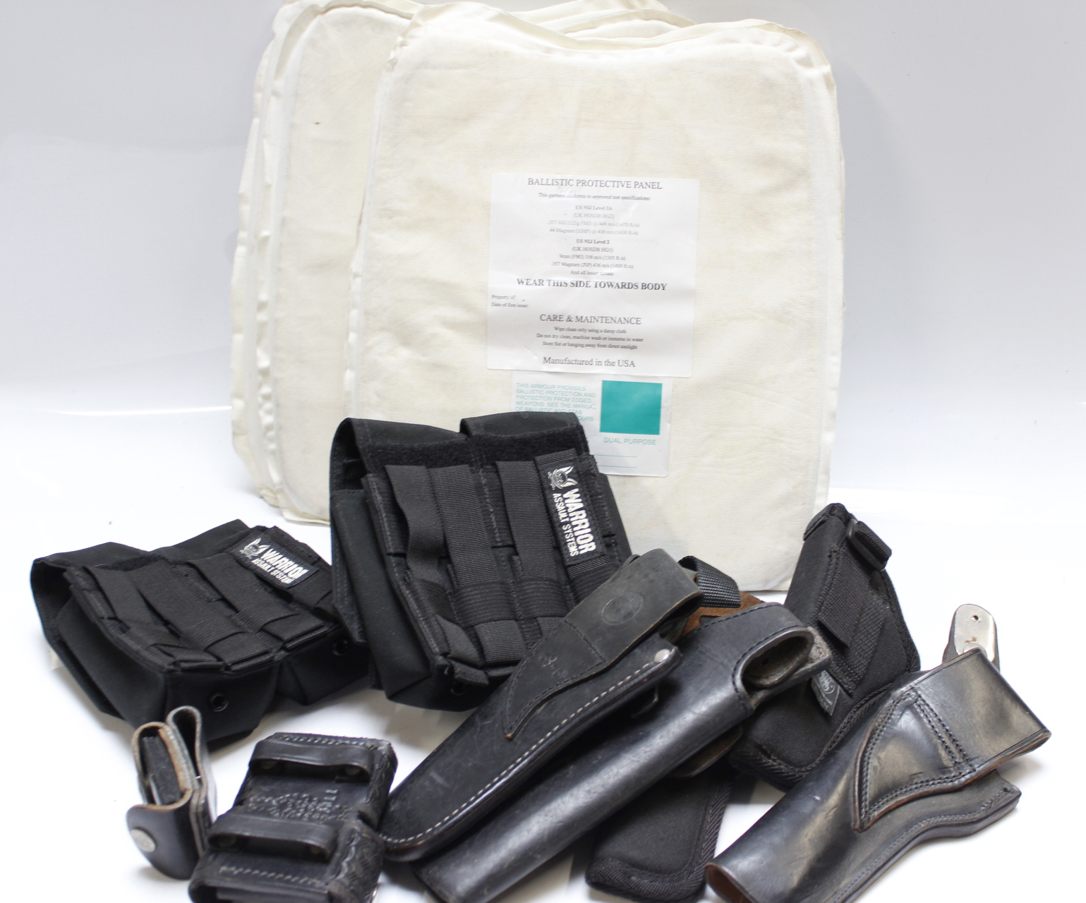 Five U.S. ballistic protective panels, NIJ level 2 & 3A, together with a selection of various holste