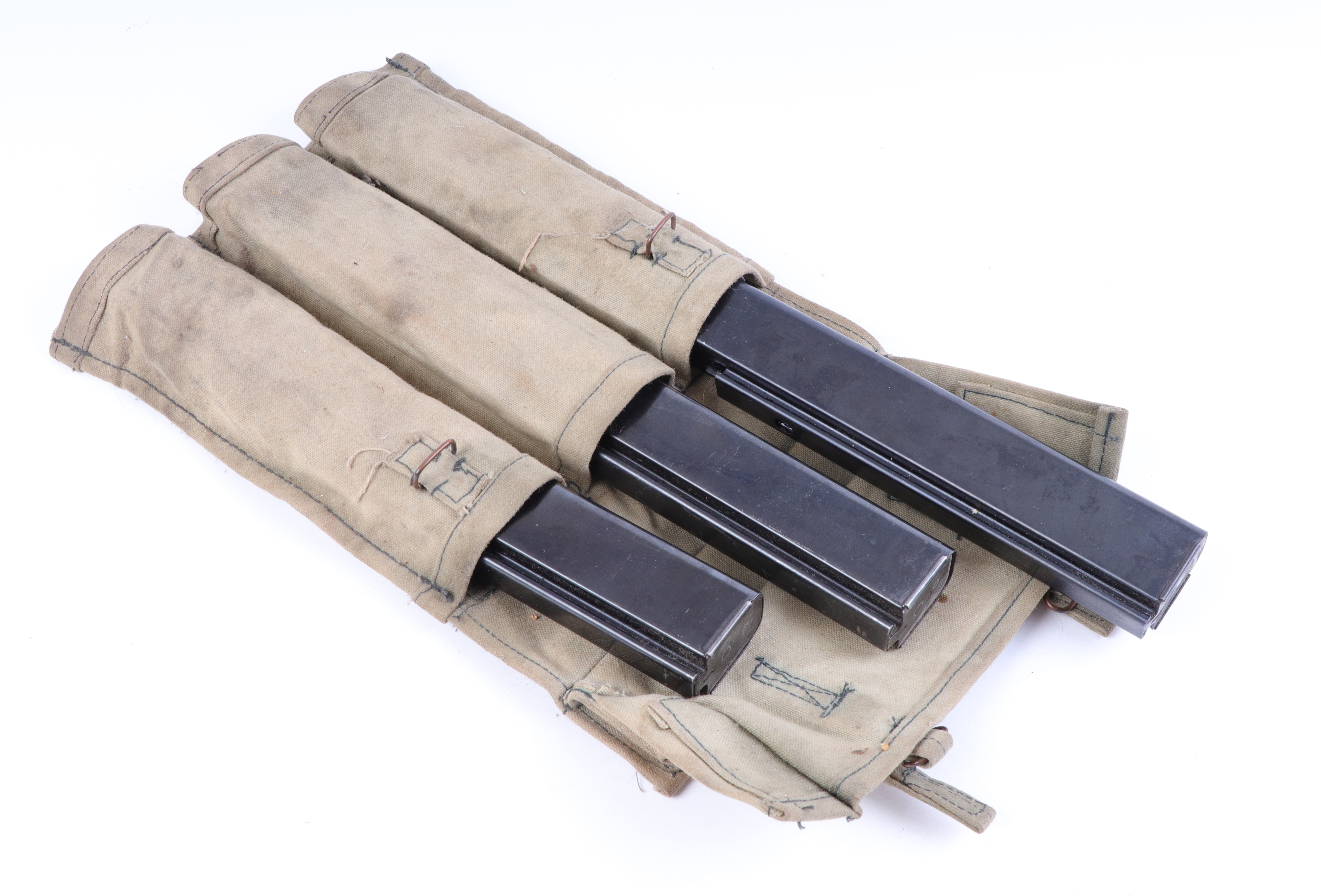 Three thompson stick magazines in military pouch