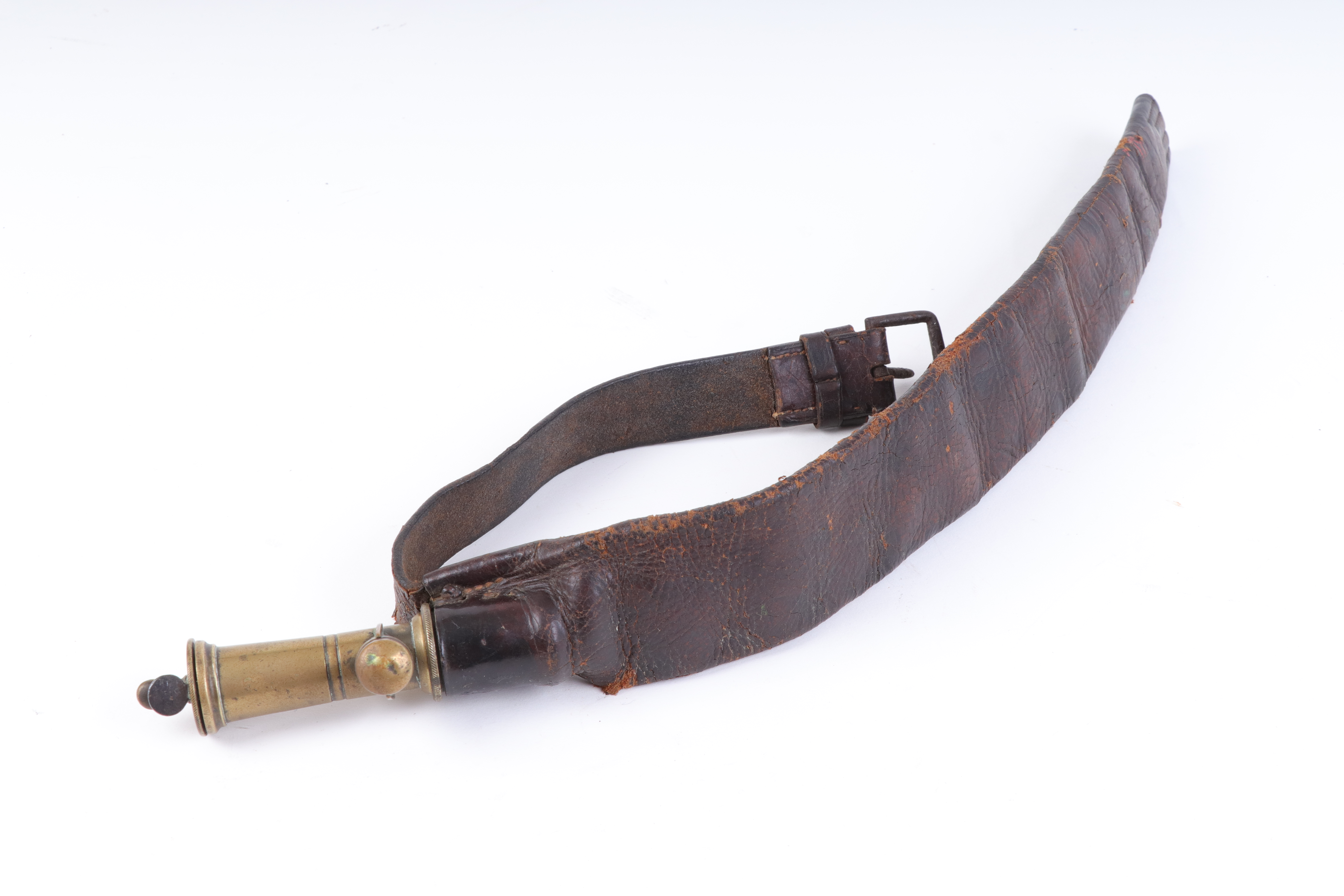 A leather strap shot belt with brass measure and cut off by James Dixon & Sons