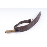 A leather strap shot belt with brass measure and cut off by James Dixon & Sons