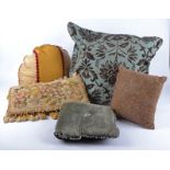 Eleven contemporary cushions, of assorted sizes and designs, some decorated with beading and one