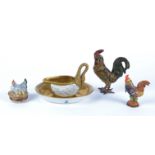 A 20th Century Dresden porcelain sauceboat and stand, modelled as a gilt swan with white glazed
