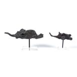 Two contemporary metal sculptures of elephants, possibly a bronze or brass structure with a black