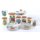 A collection of Portmeirion Pottery kitchenware, including a quiche dish five lidded jars and a