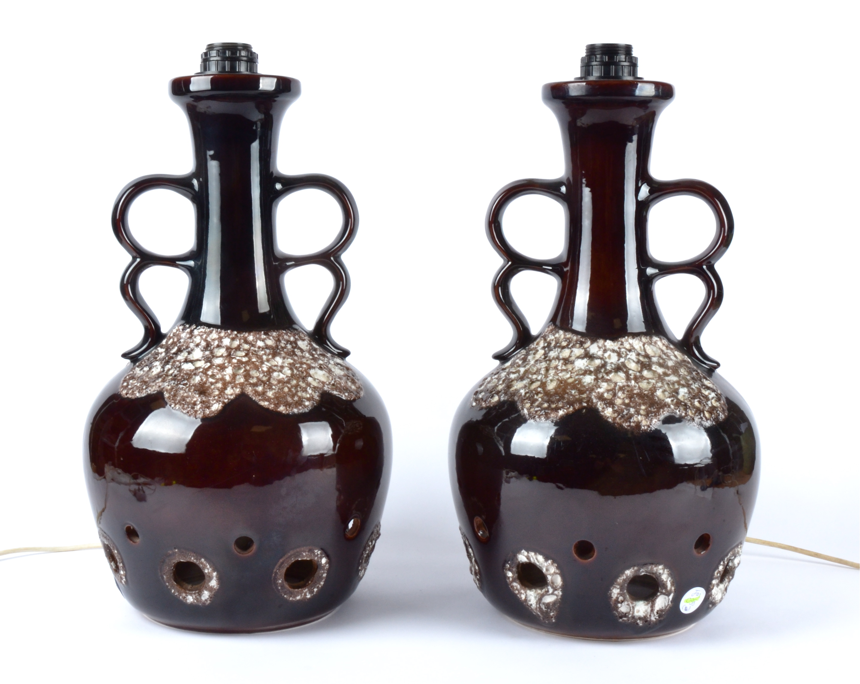 A pair of West German pottery lamp bases, with twin handles, brown glaze simulating the surface of