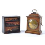 A Japanese design or 'Japanned' clock with French movement, the case decorated with traditional
