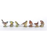 Seven Beswick pottery birds, Goldcrest, Robin, Greenfinch, Goldfinch, Whitethroat, Wren and Blue