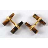 A pair of tigers eye cufflinks, with near cylindrical cuts in gilt rope twist mounts (pair)