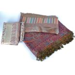 Two contemporary woollen shawls, comprising one with a zari border and decorated with scrolling