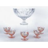 A set of five coloured glass grapefruit bowls, of pedestal from, finely decorated with hand