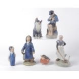Six Royal Copenhagen figures to include a boy with umbrella and raincoat, no.3556, height 17.5cm,