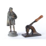 A 20th Century spelter figure of a Renaissance gentleman probably Leonardo Da Vinci with sketchbook,