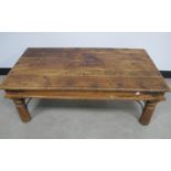 A contemporary Indonesian hardwood coffee table, with metal banding and studding, rectangular