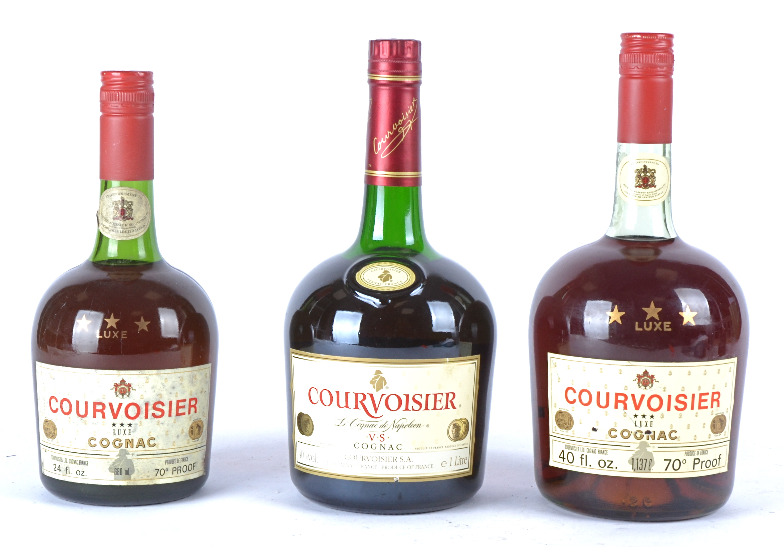 Two bottles of Courvoisier three star Luxe Cognac 40 fl ozs & 24 fl osz, together with a bottle of