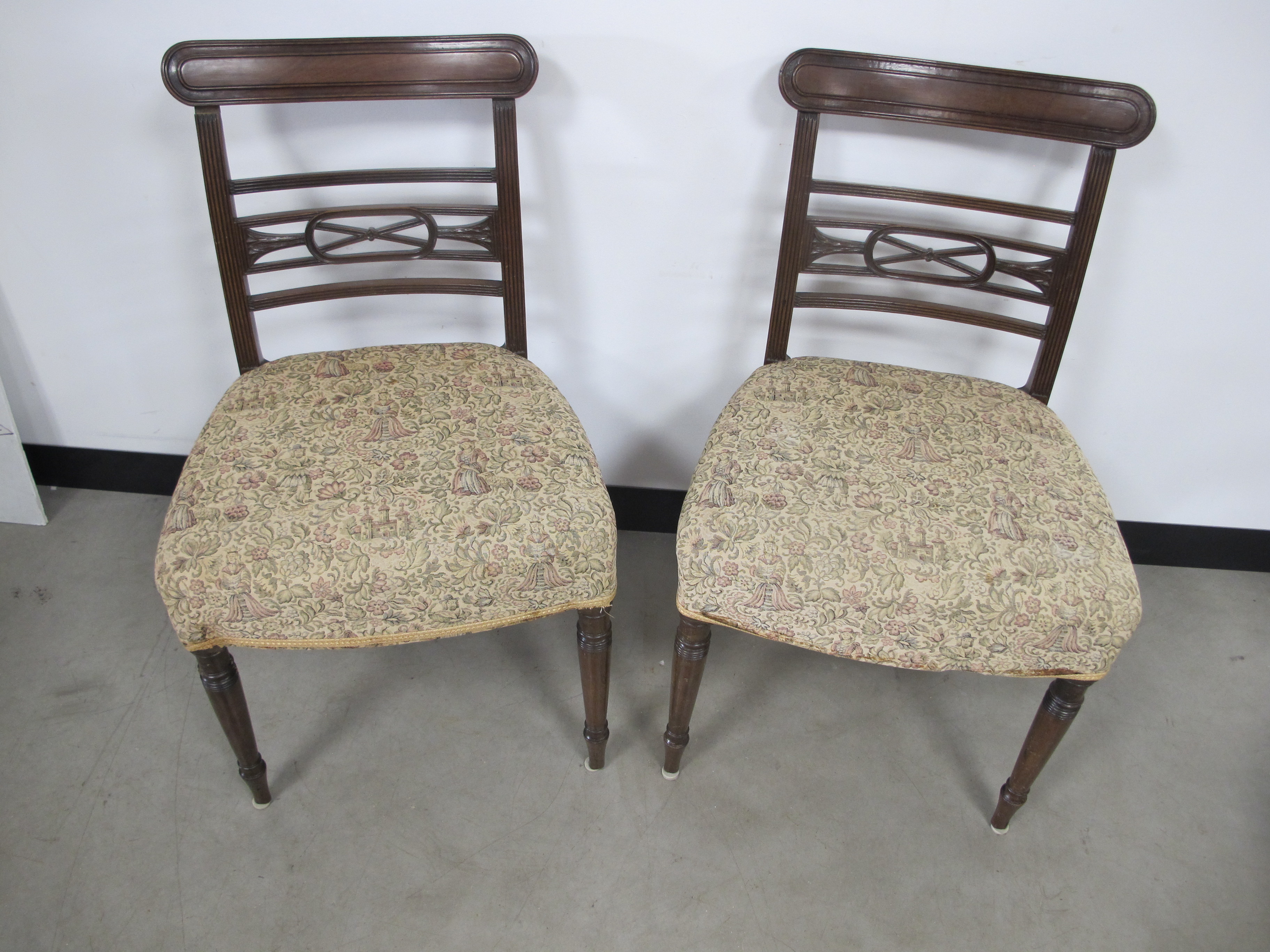 A pair of regency mahogany side chairs, oval moulded top rails, reeded back side rails, pieced