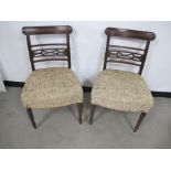 A pair of regency mahogany side chairs, oval moulded top rails, reeded back side rails, pieced