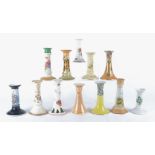 A collection of early 20th Century British and Continental porcelain candlestick holders to