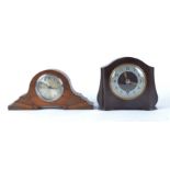 Two mid 20th Century Enfield mantle clocks, one in a oak case with carved decoration, height 15.5cm,