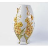 A large Italian terracotta vase, decorated with yellow flowers painted on a white glaze, 'Tanagra