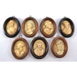 Seven 18th and 19th Century bone and ivory oval plaques with portrait profiles of historical