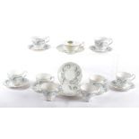 A set of eight Royal Standard tea cups and saucers, in the Garland pattern with gold gilding,